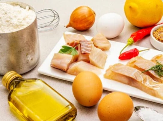 eggs, oil, meat, and other vitamin A foods on a table