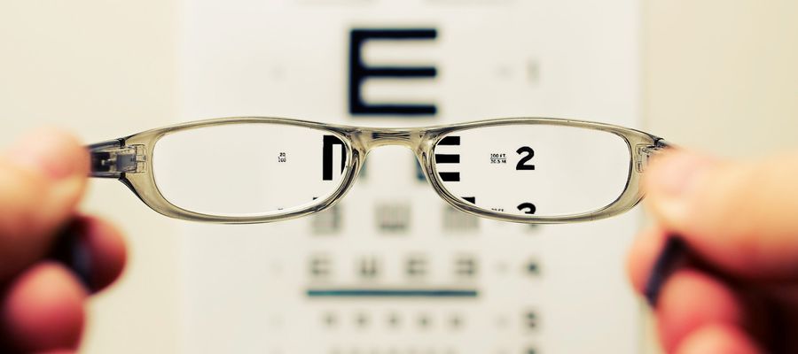 eye test seen through eyeglass lens