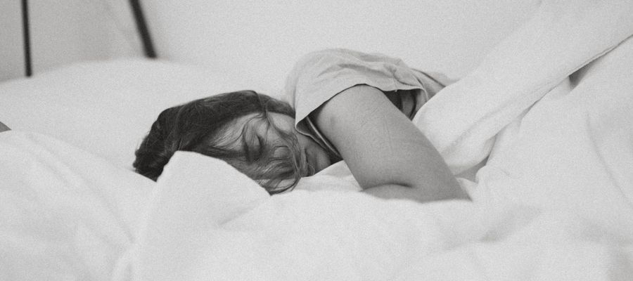 black and white photo of woman sleeping