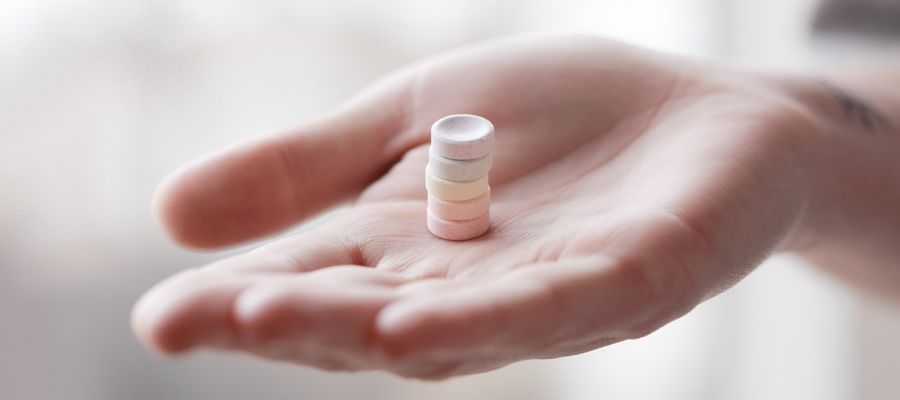 pills in a woman's palm